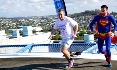 Health Minister Steven Miles and Adam Scott reach the helipad