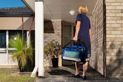 Nurse going into a home