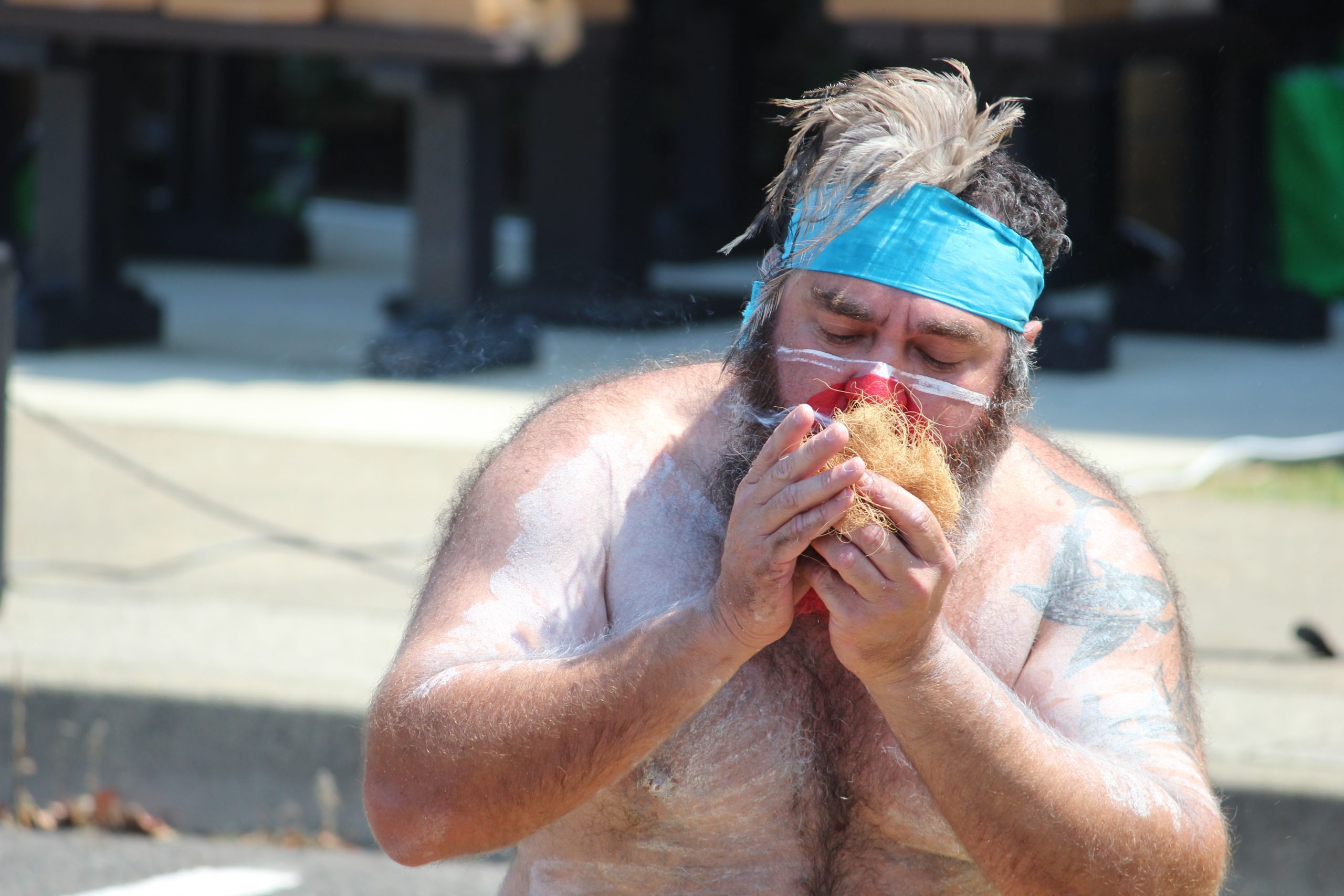 Aboriginal dancer preparing smoking ceremony