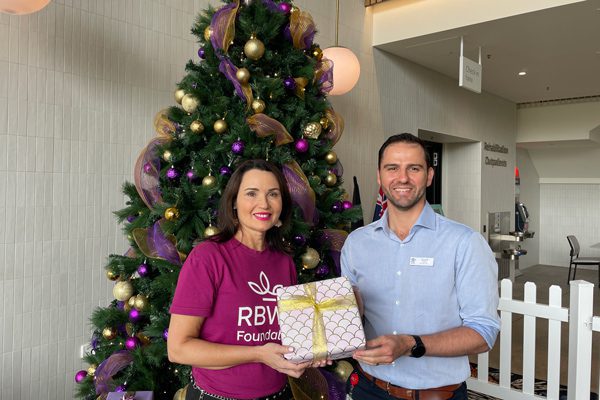 RBWH Foundation CEO Simone Garske and STARS Acting Executive Director Geoff Grima in front of the new Christmas tree at STARS