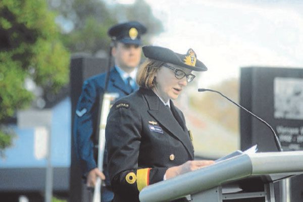 Dr Elizabeth Rushbrook in uniform at lecturn