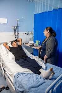 Indigenous patient Bob Lawton with Indigenous Health Liaison Officer Emma Galea