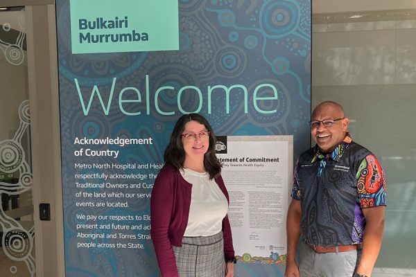 Manager Assets and Infrastructure Ann Birch and Cultural Capability Officer Henry Nona with the newly installed artworks at the Level 3 entrance to STARS.