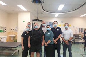 Patient Justin demonstrating the new Zero-G system at TPCH