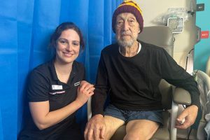 Eat Walk Engage Coordinator Ellen Murphy picture with patient Oswald at Caboolture Hospital patient boutique