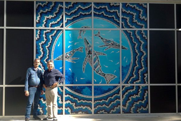 Artist Troy Little, with Geoffrey Binge, next to his artwork at RBWH’s main entrance