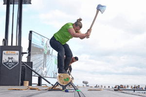 Katrina Cook of Caboolture Hospital competing in a wood chopping event