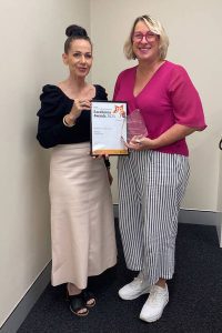 Lainie White with Amanda Philp holding award
