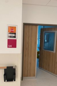 Isolation room signage on wall of new Caboolture Hospital clinical services building 