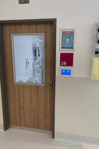 Isolation room signage on wall of new Caboolture Hospital clinical services building