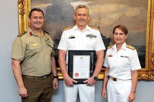 Anthony Holley in centre at a recent ceremony in Canberra