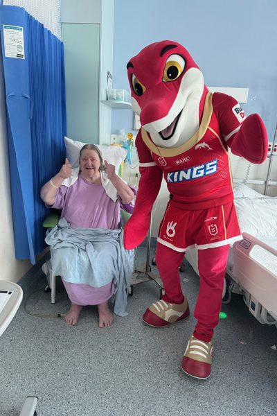Dolphins mascot Phinny pictured with patient Deb Dunn 