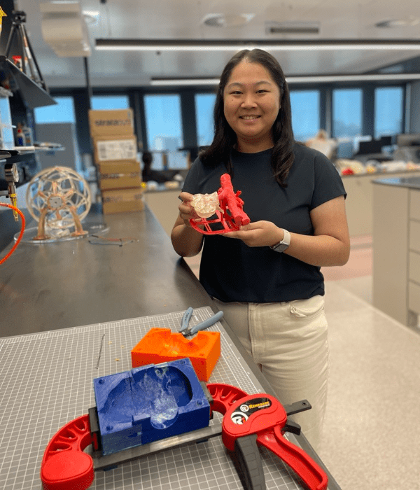 student holding 3D print