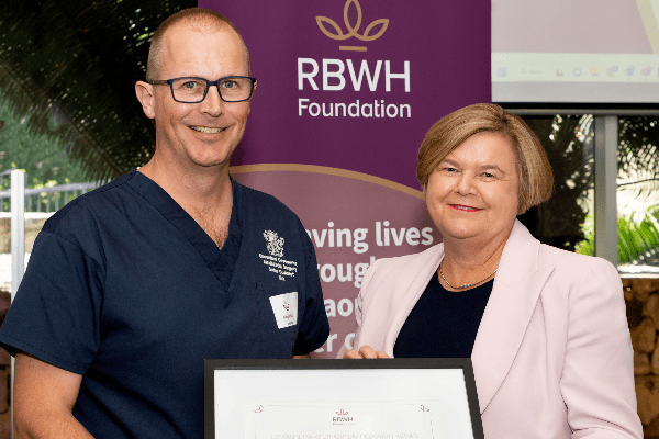 royal-foundation-nick-puls-600×400 man and woman holding award