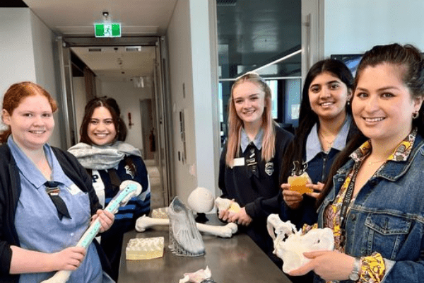students holding 3D prints