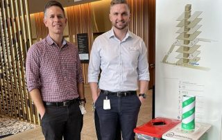 Mick Collins and Niel Verrall with the new Containers for Change bin at STARS.