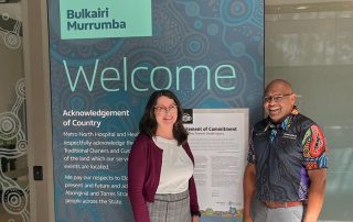 Manager Assets and Infrastructure Ann Birch and Cultural Capability Officer Henry Nona with the newly installed artworks at the Level 3 entrance to STARS.