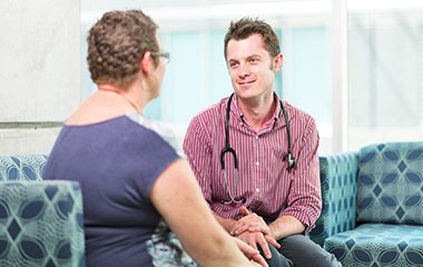 Doctor speaking with patient