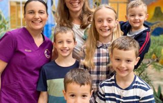 Midwife Nicole and mum Rebekah with kids
