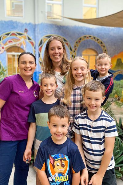 Midwife Nicole and mum Rebekah with kids