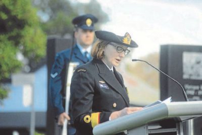 Dr Elizabeth Rushbrook in uniform at lecturn