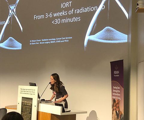 Diana Tam speaks at a conference