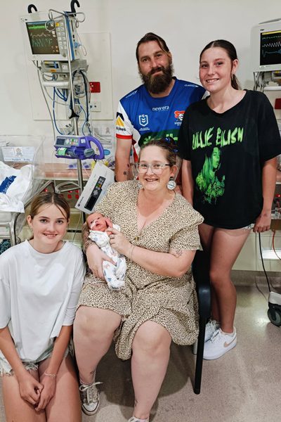 Mum Kaytlin, Dad Aarin and older sisters Allison and Isabella pictured with Teddy