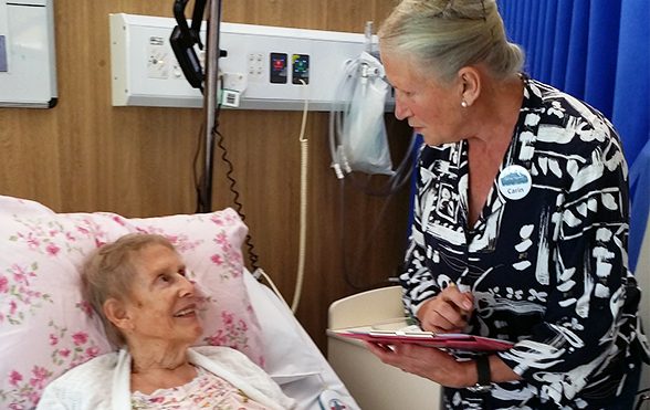 Woman helping patient Woman helping patient