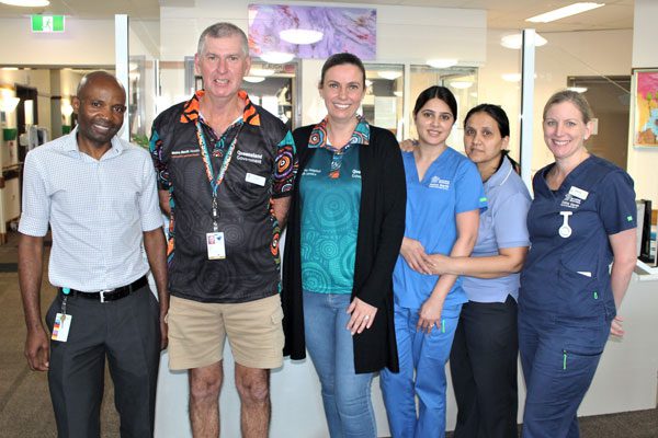 Volunteer Glenn Ellis with staff from Community and Oral Health’s Brighton Health Campus